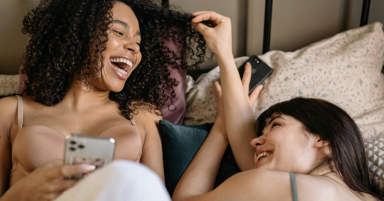 Women laughing at phone