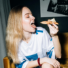 Woman eating pizza
